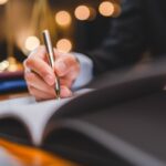 Successful,Businessmen's,Hand,Putting,Signing,Contract,Or,Agreement,Form,,Lawyers