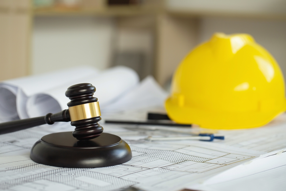 Labor,And,Construction,Law,Concept.,Judge,Gavel,On,Building,Blueprint