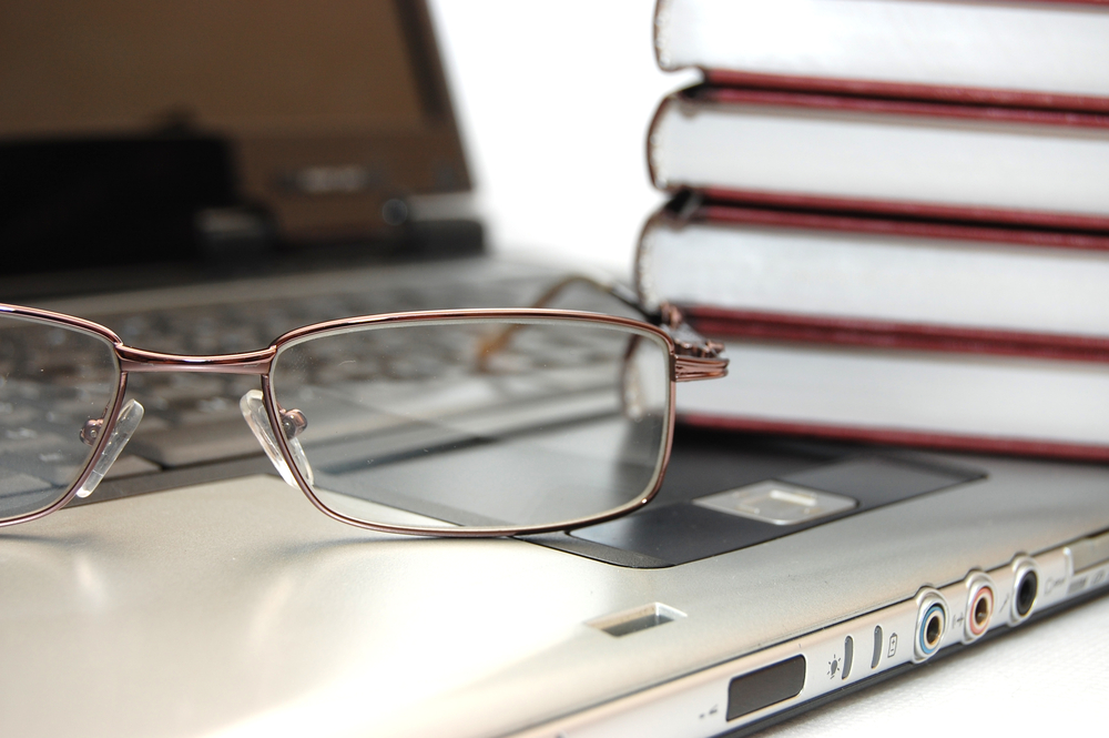 Eyeglasses,And,Books,On,The,Laptop