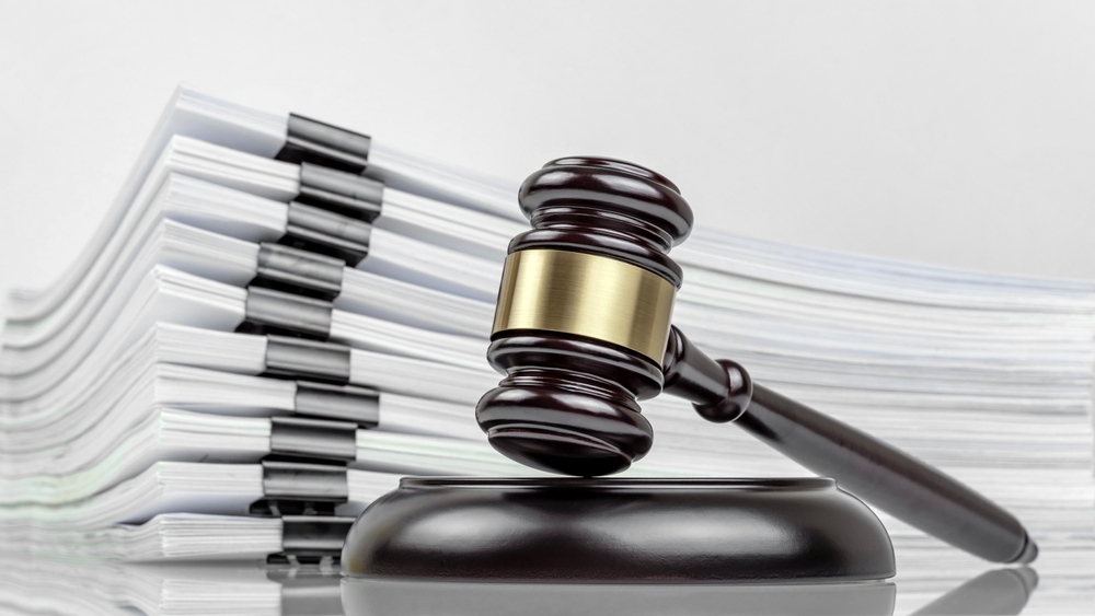 Close-up,Of,A,Judge's,Gavel,And,A,Stack,Of,Legal