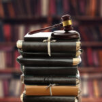 Stack,Of,Old,Paper,Folders,And,Gavel