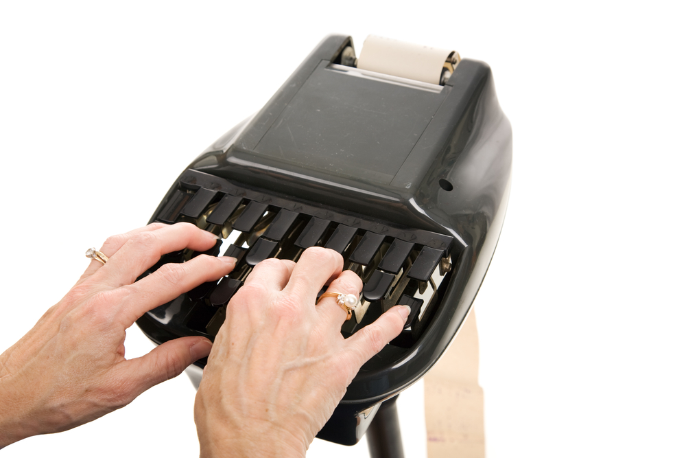 Closeup,Of,A,Court,Reporters,Hands,Typing,On,A,Stenography
