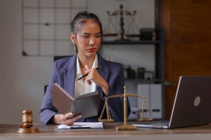 Asian,Female,People,In,Formal,Suit,With,Digital,Legal,Consultation,
